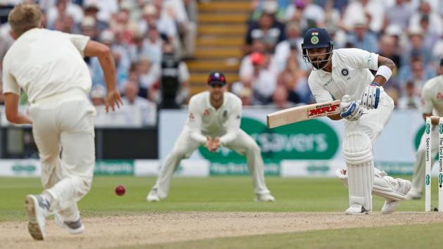 India's Virat Kohli (R) plays a shot during the third day of the first Test match between England and India at Edgbaston in Birmingham, central England on August 3, 2018.(AFP)