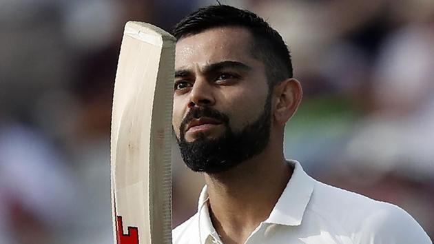 Virat Kohli celebrates after scoring his century on Day 2 of the first Test between India and England at Edgbaston.(AFP)