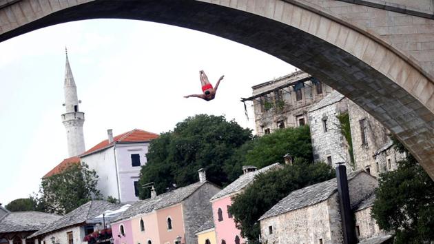 A man jumps from the Old Bridge during the 452nd traditional diving competition in Mostar, Bosnia and Herzegovina. (Dado Ruvic / REUTERS) A man jumps from the Old Bridge during the 452nd traditional diving competition in Mostar, Bosnia and Herzegovina. (Dado Ruvic / REUTERS)