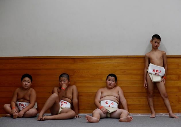 Elementary school sumo wrestlers wait for their turns in a waiting room during the Wanpaku sumo-wrestling tournament in Tokyo, Japan. (Kim Kyung-Hoon / REUTERS) Elementary school sumo wrestlers wait for their turns in a waiting room during the Wanpaku sumo-wrestling tournament in Tokyo, Japan. (Kim Kyung-Hoon / REUTERS)