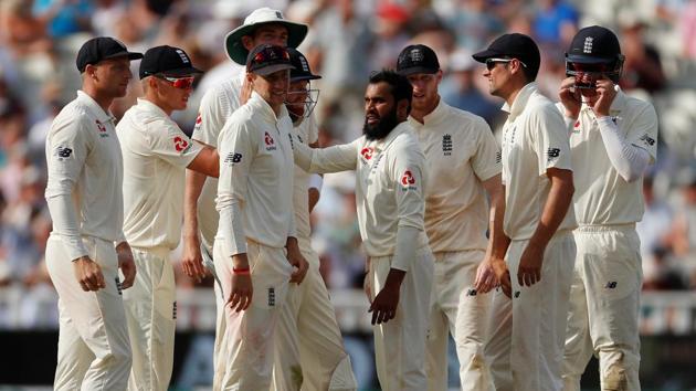 England's Adil Rashid celebrates with team mates after taking the wicket of India's Ishant Sharma. (Action Images via Reuters)