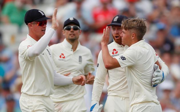 England's Sam Curran celebrates with team mates after taking the wicket of India's Hardik Pandya. (Action Images via Reuters)