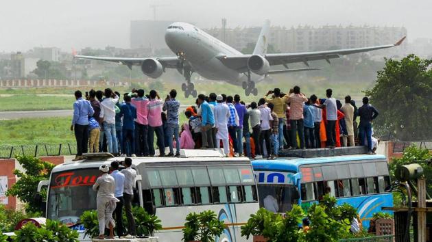 People look on as a flight carrying Haj pilgrims takes off, in Jaipur, Rajasthan on August 02, 2018. (PTI) People look on as a flight carrying Haj pilgrims takes off, in Jaipur, Rajasthan on August 02, 2018. (PTI)
