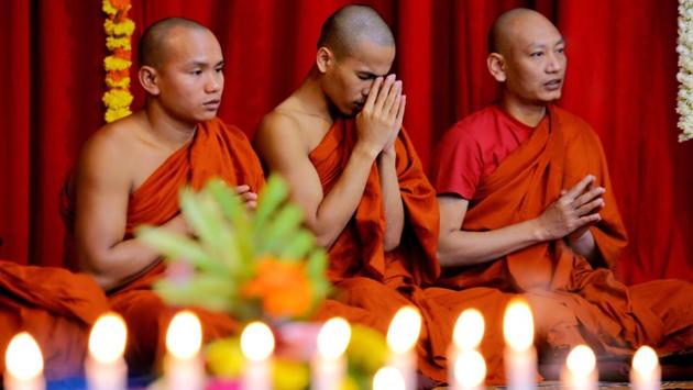 Buddhist monks pray during the 2606th 'Dhammacakka Pavattana’ day celebrations at the Maha Bodhi Society in Bangalore, Karnataka on July 29, 2018. (Manjunath Kiran / AFP) Buddhist monks pray during the 2606th 'Dhammacakka Pavattana’ day celebrations at the Maha Bodhi Society in Bangalore, Karnataka on July 29, 2018. (Manjunath Kiran / AFP)