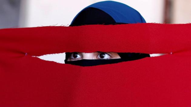 Alaa, 21, a student of health and nutrition, born in Copenhagen and wearer of the niqab, tests a face veil she created with members of the group Kvinder I Dialog (Women In Dialogue) during a workshop in preparation for a protest against the face veil ban in Copenhagen, Denmark. (Andrew Kelly / REUTERS) Alaa, 21, a student of health and nutrition, born in Copenhagen and wearer of the niqab, tests a face veil she created with members of the group Kvinder I Dialog (Women In Dialogue) during a workshop in preparation for a protest against the face veil ban in Copenhagen, Denmark. (Andrew Kelly / REUTERS)