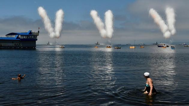People watch the Navy Day parade, in the far eastern city of Vladivostok, Russia. (Yuri Maltsev / REUTERS) People watch the Navy Day parade, in the far eastern city of Vladivostok, Russia. (Yuri Maltsev / REUTERS)