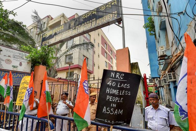 Congress activists raise slogans during a protest against controversial Assam's National Register of Citizen (NRC) draft in front of Assam House, in Kolkata. (PTI Photo) Congress activists raise slogans during a protest against controversial Assam's National Register of Citizen (NRC) draft in front of Assam House, in Kolkata. (PTI Photo)