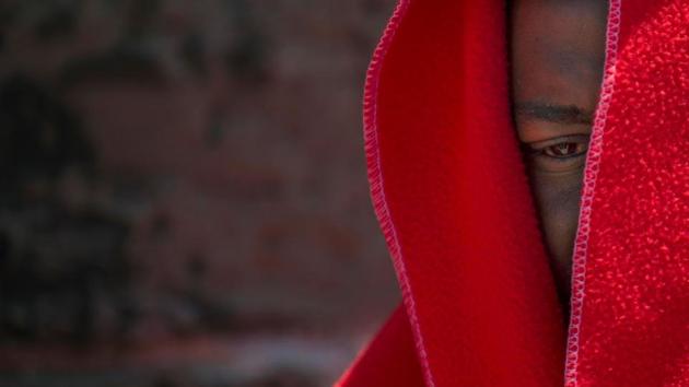 A migrant wrapped in a Red Cross blanket sits at the harbour of Tarifa. Spain has overtaken Italy as the destination of choice after a crackdown by Libyan authorities has made it more difficult for migrants to reach Italian shores. Nearly 23,000 have arrived by sea so far this year, with 307 dying in the attempt, according to the International Organization for Migration – more than all of last year. (Jorge Guerrero / AFP)