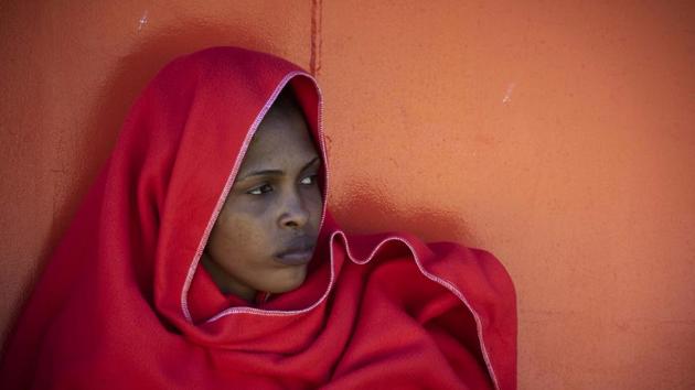 A migrant arrives after being rescued by Spain's Maritime Rescue Service in the Strait of Gibraltar, at the port of Algeciras. The authorities have not had not enough blankets, mattresses and even food for the migrants who arrived in recent days, said Ana Rosado, an activist with the Andalusian Pro-Human Rights Association (APDHA) which provides aid to the new arrivals. (Marcos Moreno / AP)