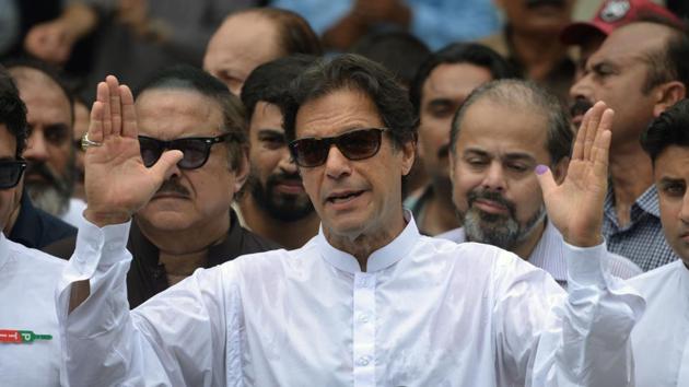 Pakistan's cricketer-turned politician Imran Khan speaks to the media after casting his vote at a polling station during the general election in Islamabad on July 25.(AFP) Pakistan's cricketer-turned politician Imran Khan speaks to the media after casting his vote at a polling station during the general election in Islamabad on July 25.(AFP)