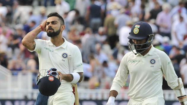 India captain Virat Kohli, left, and Dinesh Karthik will look to take India as deep as possible in their chase of 194 against England at Edgbaston. (AP)