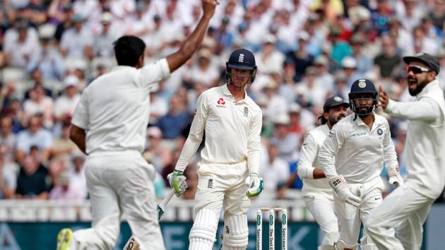England's batsman Keaton Jennings (C) looks on after losing his wicket from the bowling of India's Ravichandran Ashwin (L) during the third day of the first Test cricket match between England and India at Edgbaston in Birmingham. (AFP)