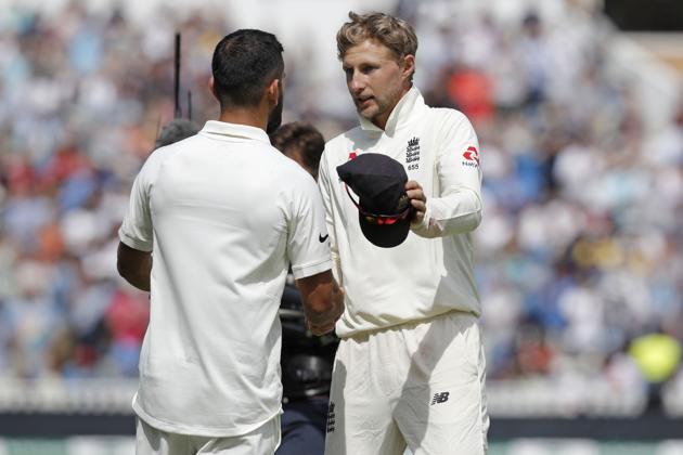 England's captain Joe Root (R) shakes hands with India's captain Virat Kohli after the game ends on the fourth day of the first Test cricket match between England and India at Edgbaston in Birmingham, central England on August 4, 2018.(AFP)