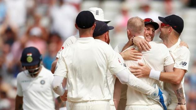 England's Ben Stokes celebrates the wicket of India's Virat Kohli with team mates.(REUTERS)