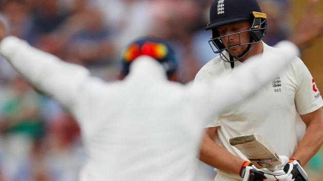 England's Jos Buttler looks dejected after being caught out by India's Dinesh Karthik. (Action Images via Reuters)