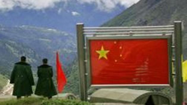 Chinese army officers on the Chinese side of the international border at Nathula Pass in Sikkim.China and India were locked in a 73-day standoff on the Doklam (Donglang in Chinese) plateau near the Sikkim border last year. (AP) Chinese army officers on the Chinese side of the international border at Nathula Pass in Sikkim.China and India were locked in a 73-day standoff on the Doklam (Donglang in Chinese) plateau near the Sikkim border last year. (AP)