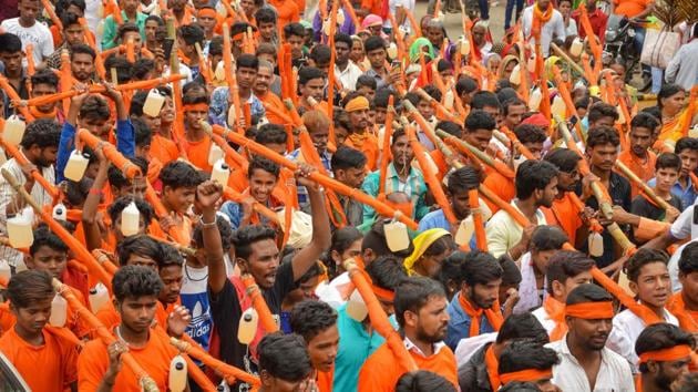 People participate in 'kanwar yatra' on the first day of Sawan month, in Jabalpur on July 28. (PTI Photo) People participate in 'kanwar yatra' on the first day of Sawan month, in Jabalpur on July 28. (PTI Photo)