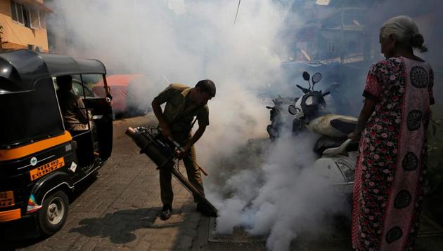 A municipal worker fumigates a manhole in a street to prevent the spread of dengue fever and other mosquito-borne diseases in Mumbai. (Reuters File Photo) A municipal worker fumigates a manhole in a street to prevent the spread of dengue fever and other mosquito-borne diseases in Mumbai. (Reuters File Photo)