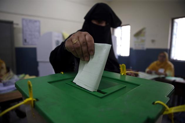 A voter casts her vote at a polling station during the general election in Islamabad, Pakistan.(REUTERS File)