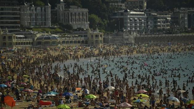 People crowds La Concha beach in the basque city of San Sebastian, northern Spain, Friday, Aug. 3, 2018. Hot air from Africa is bringing a heat wave to Europe, prompting health warnings about Sahara Desert dust and exceptionally high temperatures that could peak at 47 degrees Celsius (117 Fahrenheit) in Spain and Portugal. (AP Photo) People crowds La Concha beach in the basque city of San Sebastian, northern Spain, Friday, Aug. 3, 2018. Hot air from Africa is bringing a heat wave to Europe, prompting health warnings about Sahara Desert dust and exceptionally high temperatures that could peak at 47 degrees Celsius (117 Fahrenheit) in Spain and Portugal. (AP Photo)