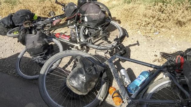 In this photo taken on Sunday, July 29, 2018, cycles are left where four tourists were killed when a car rammed into a group of foreigners on bicycles south of the capital of Dushanbe, Tajikistan. (AP Photo)