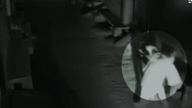 A screenshot of a man grabbing a woman’s neck in Shahdara.(CCTV Screengrab)