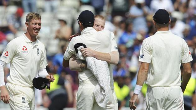 Teammate congratulate England's Ben Stokes, center right, for the dismissal of India's Hardik Pandya leading their team to victory in the first test cricket match between England and India at Edgbaston in Birmingham. (AP)
