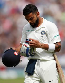Virat Kohli looks dejected after losing his wicket. (REUTERS)