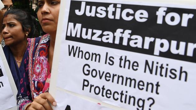 Activists hold placards as they take part in a protest over the sexual assault of girls at a state-run home in Bihar, near Bihar Bhawan in New Delhi on July 30.(AFP Photo)