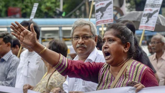 Communist Party of India (Marxist) activists take part in a protest rally against the Assam's National Register of Citizen(NRC) draft, in Kolkata on Sunday.(PTI Photo)