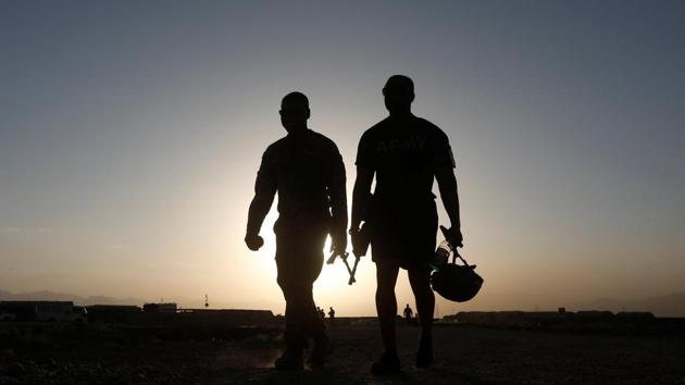 US troops walk at their base in Logar province, Afghanistan on August 4. (REUTERS) US troops walk at their base in Logar province, Afghanistan on August 4. (REUTERS)