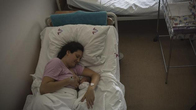 Aleksandra Milenovic breastfeeds her 24-hour-old baby Milica at the Obstetrics and gynecological Clinic "Narodni Front" in Belgrade. (AFP) Aleksandra Milenovic breastfeeds her 24-hour-old baby Milica at the Obstetrics and gynecological Clinic "Narodni Front" in Belgrade. (AFP)