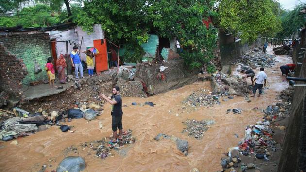 People inspect damage caused by flash floods following heavy rains at Kalka Colony, in Jammu. Heavy rain was reported in northern districts of Haryana, including Karnal, Yamunanagar, Kaithal and Kurukshetra. Rains in the last 24 hours have triggered landslides in several places across Himachal Pradesh. More than 100 lateral roads in the state were closed after being damaged by landslides. (PTI) People inspect damage caused by flash floods following heavy rains at Kalka Colony, in Jammu. Heavy rain was reported in northern districts of Haryana, including Karnal, Yamunanagar, Kaithal and Kurukshetra. Rains in the last 24 hours have triggered landslides in several places across Himachal Pradesh. More than 100 lateral roads in the state were closed after being damaged by landslides. (PTI)