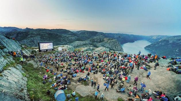 Fans hike up Pulpit Rock where Paramount Pictures organised a special screening of Mission: Impossible - Fallout, in Forsand, Norway.(PTI)