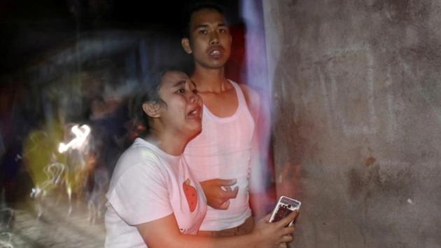 People react following the earthquake in Ampenan district. Video showed screaming people running in panic from houses in a Bali neighbourhood and vehicles rocking. On Lombok, soldiers and other rescuers carried injured people on stretchers and carpets to an evacuation center. (Ahmad Subaidi / Antara Foto / REUTERS) People react following the earthquake in Ampenan district. Video showed screaming people running in panic from houses in a Bali neighbourhood and vehicles rocking. On Lombok, soldiers and other rescuers carried injured people on stretchers and carpets to an evacuation center. (Ahmad Subaidi / Antara Foto / REUTERS)