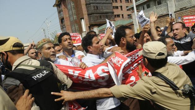 Traders shout slogans during a march on the second day of shutdown to protest against challenging Article 35A at Lal Chowk, Srinagar. The Supreme Court on Monday adjourned the hearing of petitions challenging the validity of Article 35A, which allows special rights to permanent residents of Jammu and Kashmir, amid a statewide shutdown declared by Kashmiri separatists and a number of organisations. The top court said it will hear the petitions from August 27. (Waseem Andrabi / HT Photo) Traders shout slogans during a march on the second day of shutdown to protest against challenging Article 35A at Lal Chowk, Srinagar. The Supreme Court on Monday adjourned the hearing of petitions challenging the validity of Article 35A, which allows special rights to permanent residents of Jammu and Kashmir, amid a statewide shutdown declared by Kashmiri separatists and a number of organisations. The top court said it will hear the petitions from August 27. (Waseem Andrabi / HT Photo)