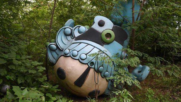 Beibei, one of five mascots for the 2008 Beijing Olympic Games, lies behind an abandoned, never-completed mall in Beijing. A decade after the 2008 Olympics, its legacy remains unmistakable from the smallest alleyways in the Chinese capital to the country’s growing clout abroad. For better or worse, the Games changed the face of Beijing: from the iconic Bird’s Nest stadium to the countless blocks of ancient homes bulldozed in an Olympic building frenzy. (Greg Baker / AFP)