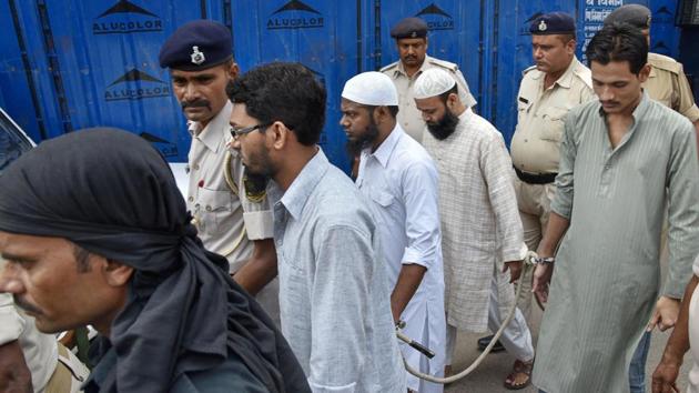 A file photo shows convicts in the 2013 Bodh Gaya serial blasts case being escorted by the police after National Investigation Agency (NIA) special court awarded life imprisonment to all five accused, in Patna. (PTI FILE PHOTO) A file photo shows convicts in the 2013 Bodh Gaya serial blasts case being escorted by the police after National Investigation Agency (NIA) special court awarded life imprisonment to all five accused, in Patna. (PTI FILE PHOTO)