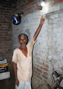 Vijay Rawat, 52, of Malauli village elated at getting a power connection in his house. (HT Photo) Vijay Rawat, 52, of Malauli village elated at getting a power connection in his house. (HT Photo)