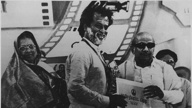 Actor Rajinikanth receiving the best actor award from Karunanidhi at the Tamil Nadu Government’s Annual Film Awards presentation function in Chennai in May 1997. (HT Archive) Actor Rajinikanth receiving the best actor award from Karunanidhi at the Tamil Nadu Government’s Annual Film Awards presentation function in Chennai in May 1997. (HT Archive)