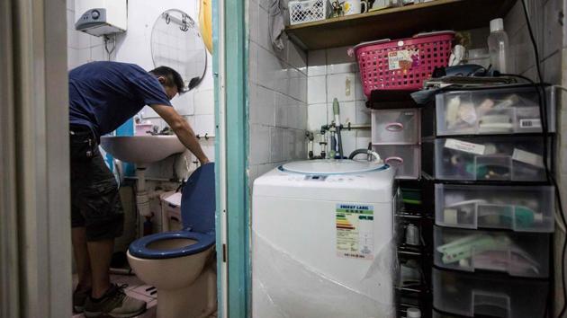 A volunteer plumber repairs a toilet for a resident who had requested help from Fixing Hong Kong, a pro-democracy community group, in Hong Kong. As attendance at Hong Kong’s traditional protest rallies wanes, this pro-democracy group is trying to win hearts and minds in a more pragmatic way – by mending broken appliances, furniture, pipes and wiring, hoping that forging community spirit will lead to greater political awareness. (Isaac Lawrence / AFP)