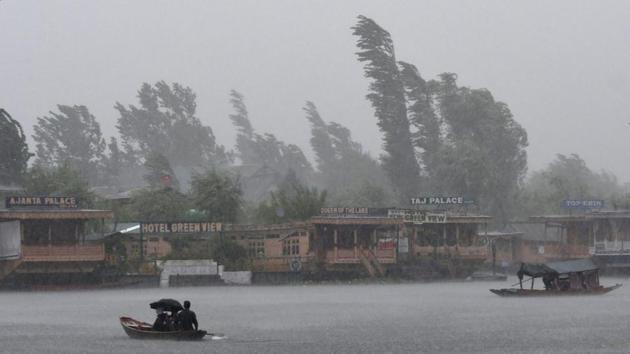 People row boats during heavy rainfall in Srinagar. In Chandigarh, mercury dropped by seven notches as the city received 18.4mm rain. At 25.4°C, the maximum temperature was lowest recorded on any August day since 1997. It was also the coolest day of the city of this monsoon. (Tauseef Mustafa / AFP) 