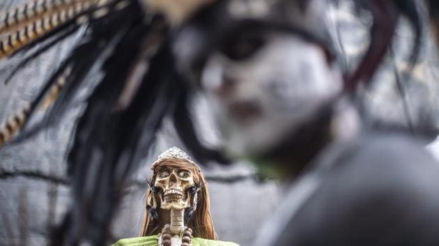 The Santa Muerte figure finds references in Mexican culture dating into Spanish colonial times, when Catholic colonizers on evangelical missions, brought over female Grim Reaper figures representing death. Similarities in existing Aztec and Mayan traditions smoothed over the process of co-opting this female skeletal figure as a religious icon. (Pedro Pardo / AFP)