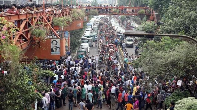 Students block a road as they join in a protest over recent traffic accidents that killed a boy and a girl in Dhaka. After a nine-day-long stir students ended their protest. (Reuters Photo) Students block a road as they join in a protest over recent traffic accidents that killed a boy and a girl in Dhaka. After a nine-day-long stir students ended their protest. (Reuters Photo)