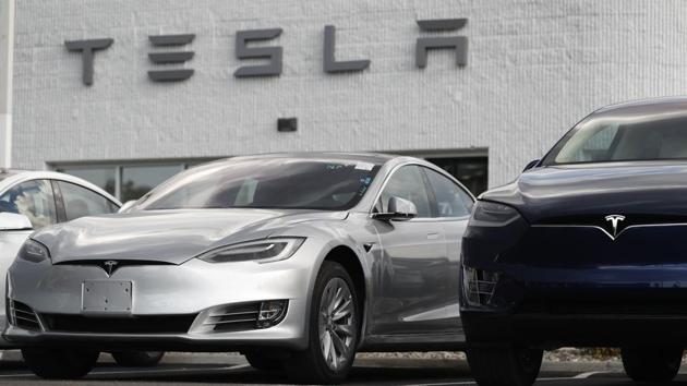 2018 Model 3 sedan sits next to a Model X on display outside a Tesla showroom in Littleton, Colo. (AP Photo) 2018 Model 3 sedan sits next to a Model X on display outside a Tesla showroom in Littleton, Colo. (AP Photo)
