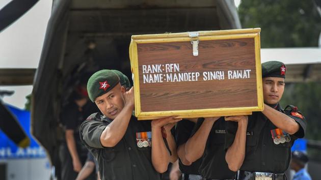 The mortal remains of Rifleman Mandeep Singh Rawat being taken for wreath laying ceremony at Palam Tecnical area in New Delhi on Wednesday.(PTI)