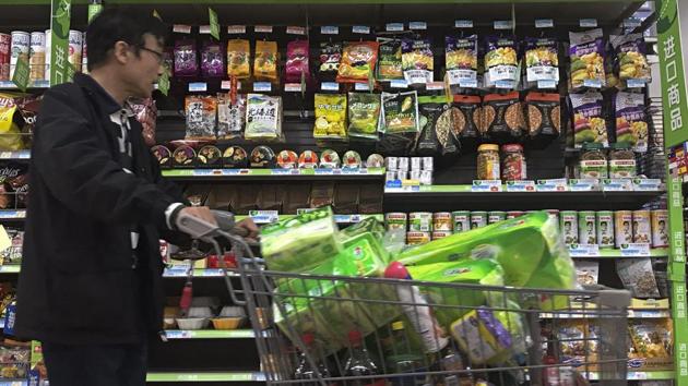 A man pushes a shopping cart past a display of nuts imported from the United States and other countries at a supermarket in Beijing. China confirmed that it will impose 25 percent tariffs on an additional $16 billion worth of imports from the US from August 23, 2018. (AP Photo) A man pushes a shopping cart past a display of nuts imported from the United States and other countries at a supermarket in Beijing. China confirmed that it will impose 25 percent tariffs on an additional $16 billion worth of imports from the US from August 23, 2018. (AP Photo)
