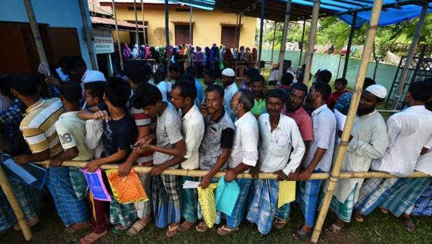 People wait in queue to check their names on the draft list at the National Register of Citizens (NRC) centre at a village in Nagaon district, Assam. (Reuters Photo) People wait in queue to check their names on the draft list at the National Register of Citizens (NRC) centre at a village in Nagaon district, Assam. (Reuters Photo)