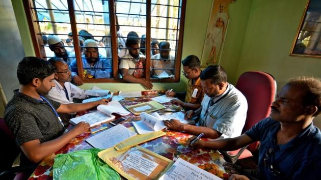 People wait to check their names on the draft list at the National Register of Citizens (NRC) centre at a village in Nagaon district, Assam. (Reuters Photo) People wait to check their names on the draft list at the National Register of Citizens (NRC) centre at a village in Nagaon district, Assam. (Reuters Photo)