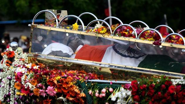 A glass casket carrying body of Dravida Munnetra Kazhagam (DMK) party president M Karunanidhi is seen during the funeral procession, in Chennai. (AFP Photo)